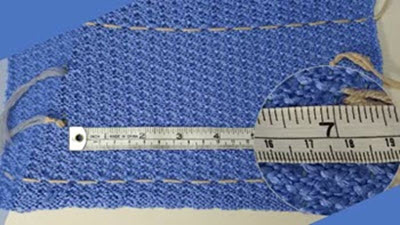 Swatching is NOT a waste of yarn A neatly machine-knitted gauge swatch with even stitches and clear borders, demonstrating correct swatching technique