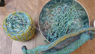 Keep on Track When Ripping A bowl containing ripped-out yarn from a knitting project, curled in characteristic ripples from being previously knitted