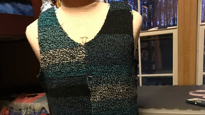 Self Striping Yarn Display of machine knitted sweater in self-striping yarn, revealing how garment width affects stripe patterns