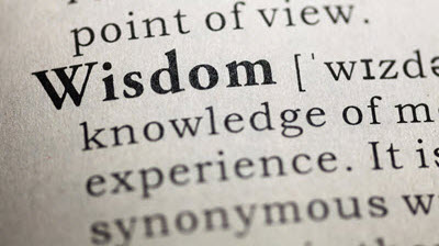 Dictionary page showing 'wisdom' definition, representing shared knowledge from experienced machine knitters