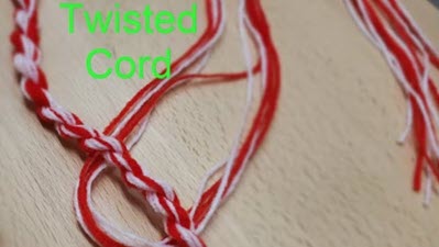 Twisted Cord Fun Demonstration of twisted cord creation showing loose yarn strands next to finished twisted cord