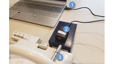 DesignaKnit with Non Electronic Machines DesignaKnit software interface connected to a non-electronic knitting machine via specialized cables, showing how manual machines can be integrated with digital knitting software