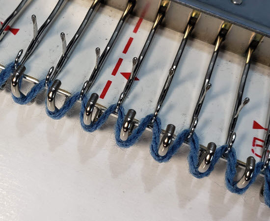 Automatic cast-on in machine knitting