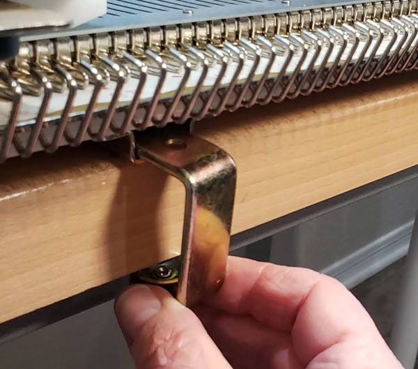 Clamps for securing knitting machines to tables