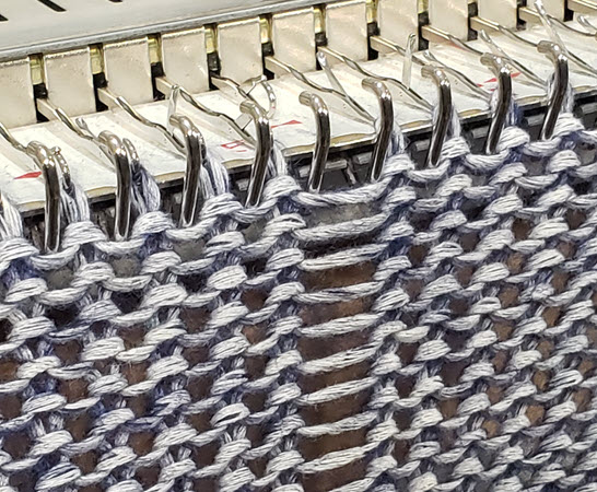 Ladder in machine knitting created by dropped stitches