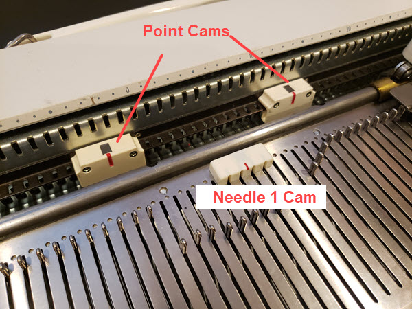 Point cams used in Singer, Silver, and Studio machines to define the range of pattern knitting Point cams used to control pattern knitting range