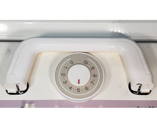 Tension Dial on Knitting Machine Carriage