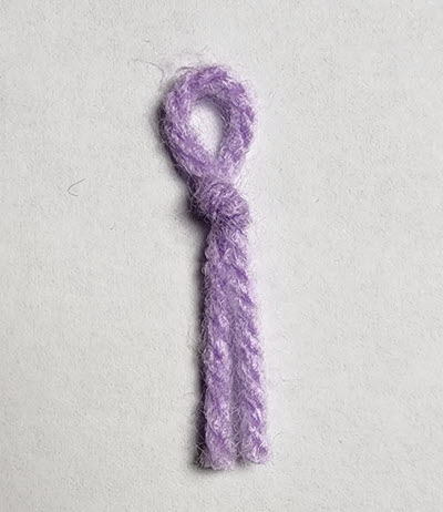 Yarn Marker used to track stitch and row counts or mark the center of pieces in machine knitting Yarn Marker for tracking stitches and rows in machine knitting